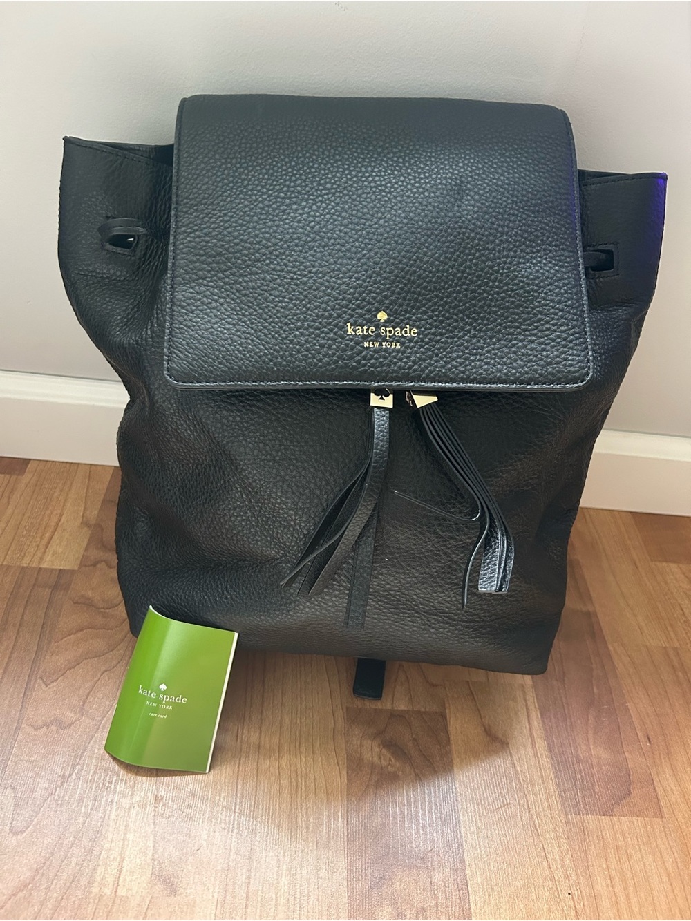 kate spade Black Pebbled Leather Backpack with Tassel Detail